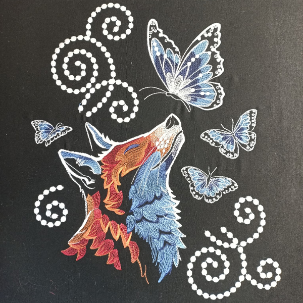 Embroidered wolf and butterflies on black fabric