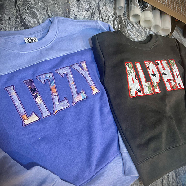Custom embroidered sweatshirts with colorful lettering