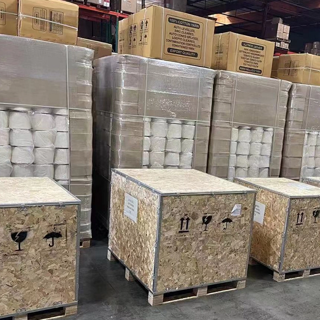 Stacked wooden crates on pallets inside a warehouse